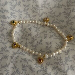 Dainty bracelet with tiny pearls and evil eyes for protection